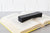 Curiously Heavy Book Weight – Smoldered Black