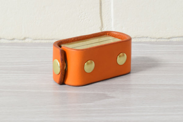 Nomad Book Weight –  Orange/Brass