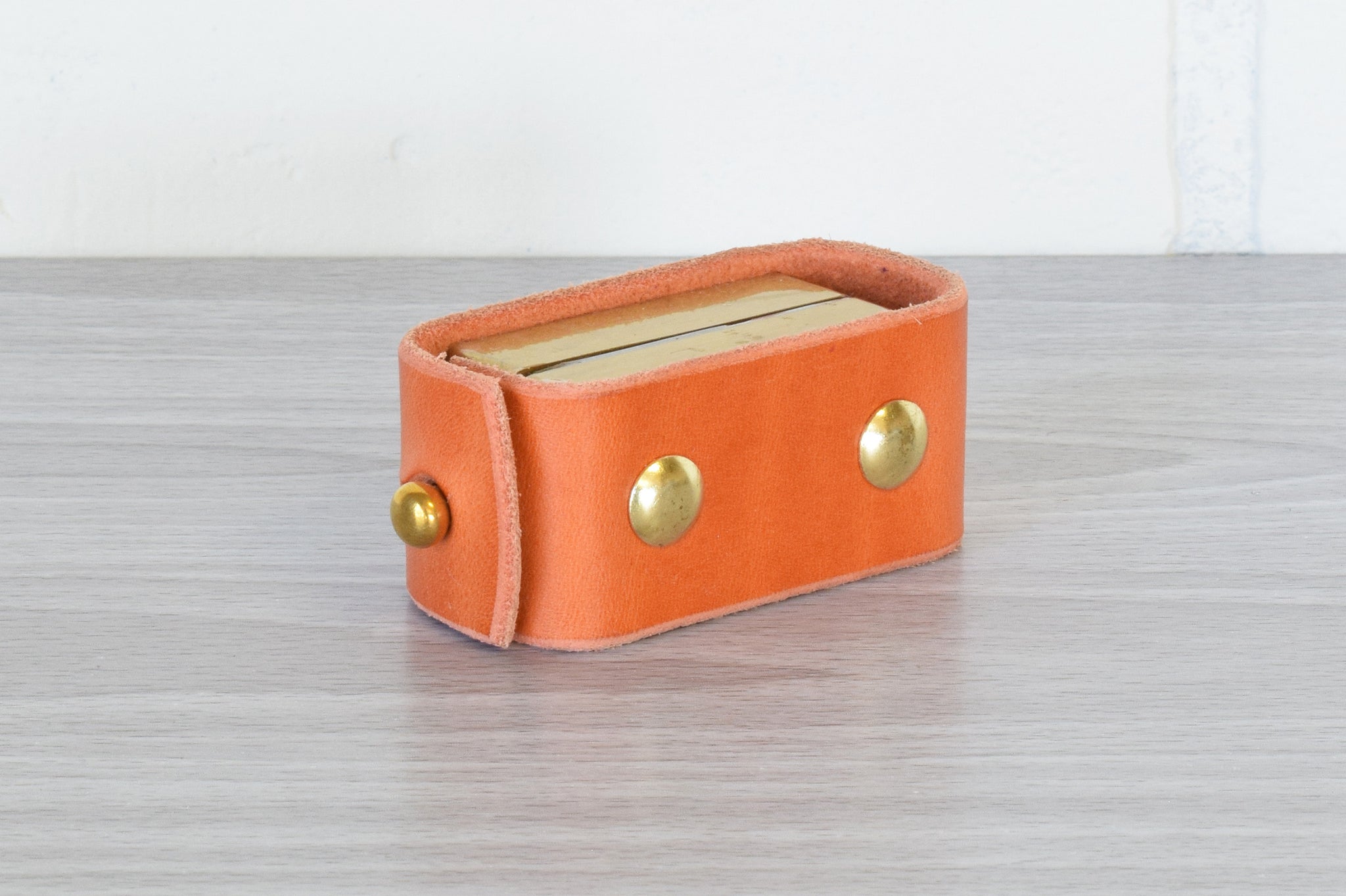 Nomad Book Weight – Orange with Brass