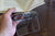 Hand holding a book with a book clip in the open position