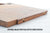 Walnut drop roll stop shown in the lower position on a wood lap desk
