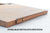 Walnut drop roll shown in the shown in the up position on a wood lap desk